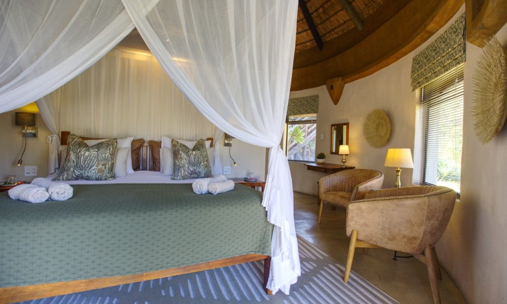Big-5, luxury Rondavel room - 5-star Lengau Lodge - Kruger National Park - luxury cushions on the beds and make-up dressing table, private terrace, overlooking the waterhole