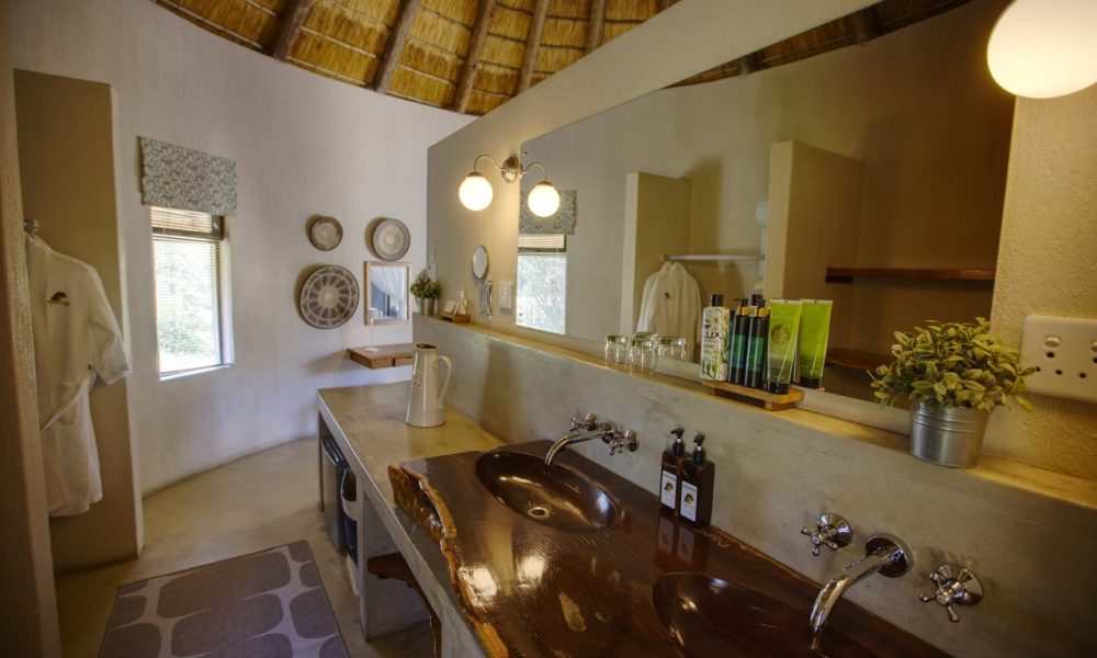 Lengau Lodge - Kruger National Park - Impala -luxury rondavel room, double XL bed with luxury cushions and mosquito netting, bathroom inside and outside shower, private terrace, overlooking the waterhole