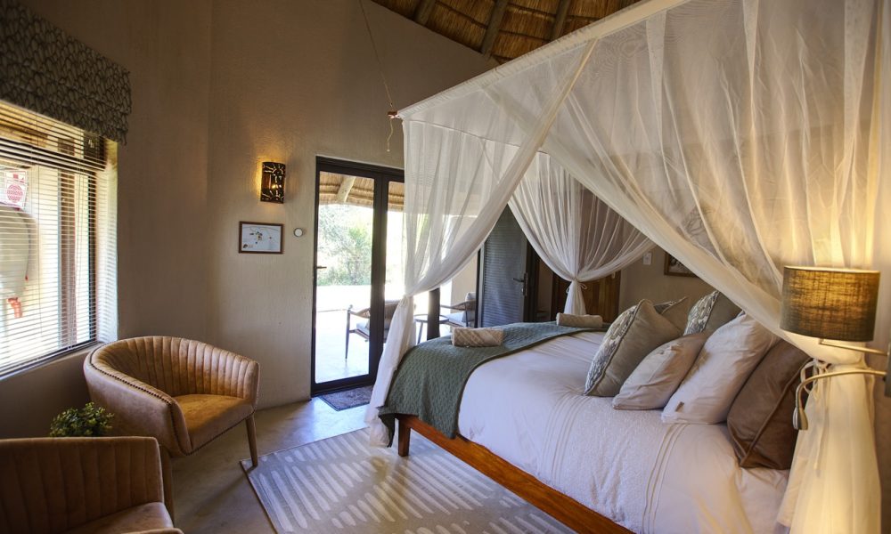 Lengau Lodge - Kruger National Park - Impala -luxury rondavel room, double XL bed with luxury cushions and mosquito netting, bathroom inside and outside shower, private terrace, overlooking the waterhole