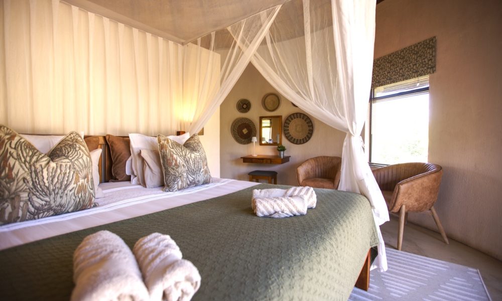 Lengau Lodge - Kruger National Park - Kudu luxury Rondavel room - double XL bed mosquito netting, dressing table, private terrace with view to waterhole
