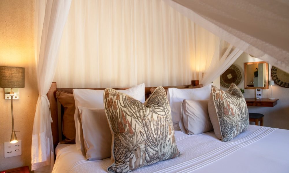Lengau Lodge - Kruger National Park - Kudu luxury Rondavel room - double XL bed mosquito netting, dressing table, private terrace with view to waterhole